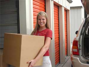 girl carrying boxes at Marymoor Self Storage Redmond WA